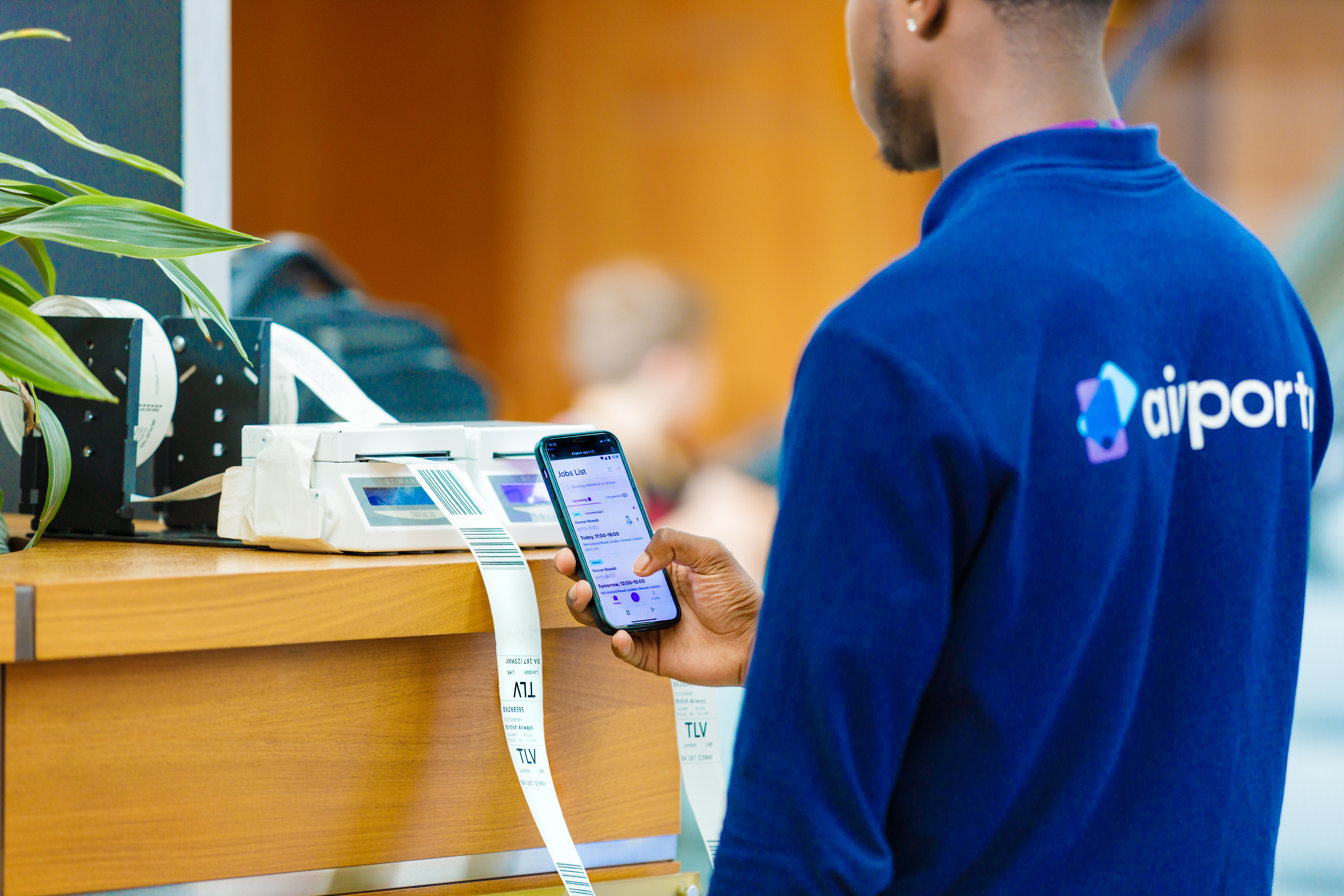 Airportr staff checking baggage into airline systems